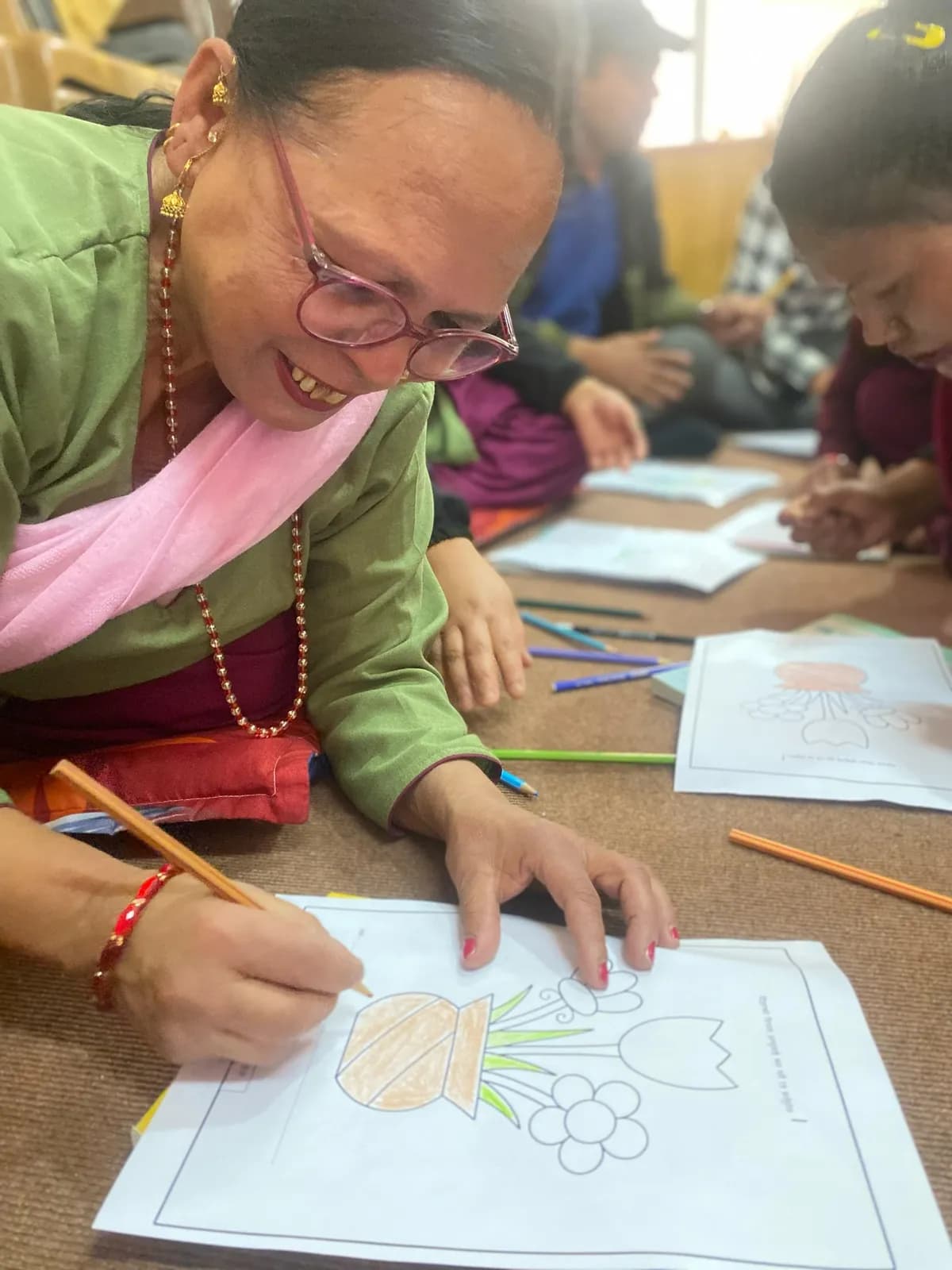 Teacher engaged in a creative classroom workshop